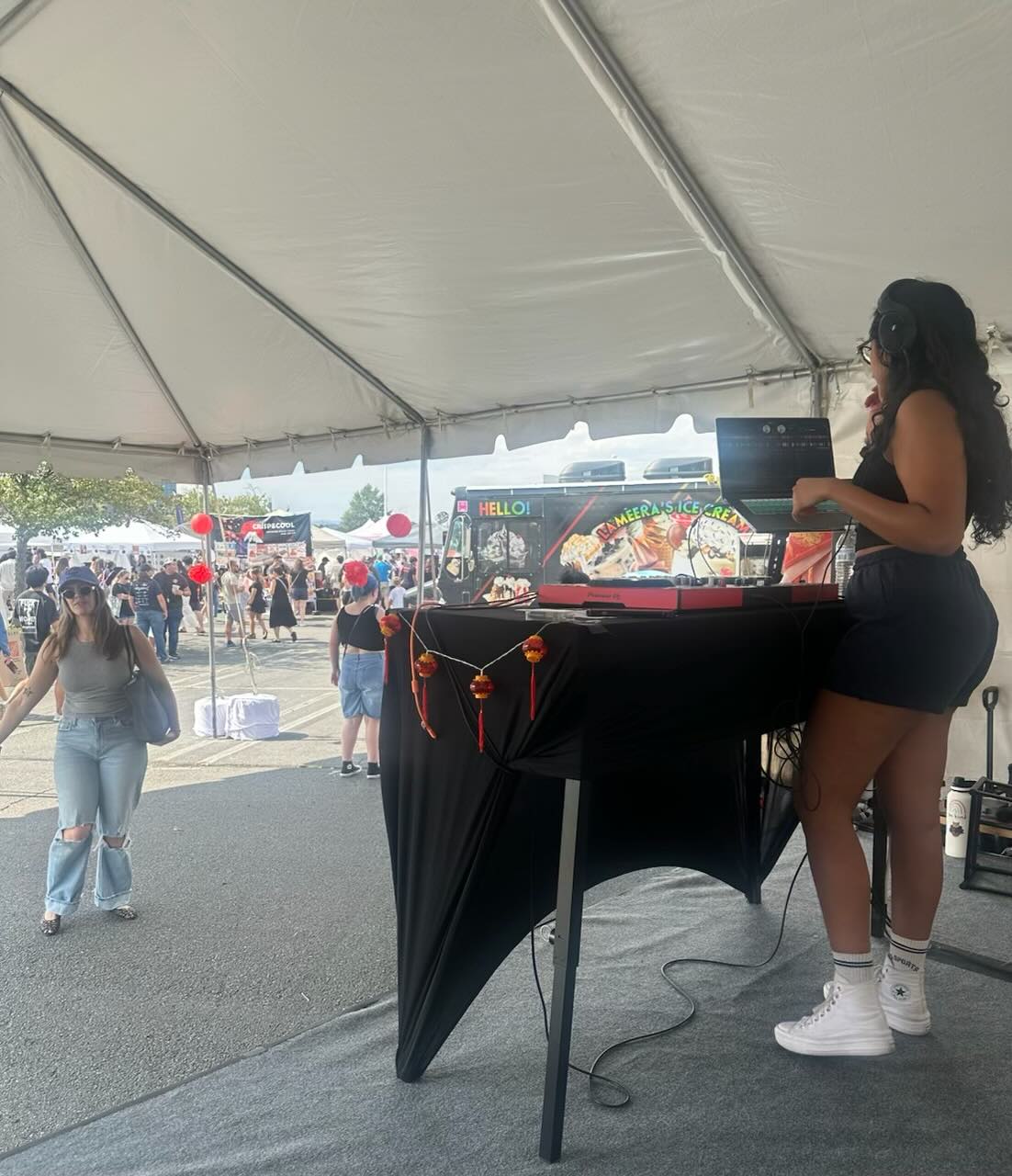 DJ Xhama playing an outdoor festival set